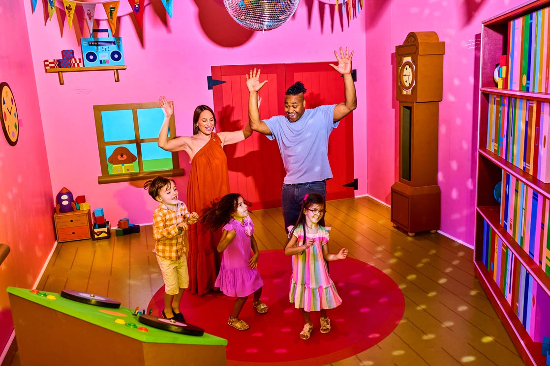 CBeebies Rainbow Adventure - Children and adults in house